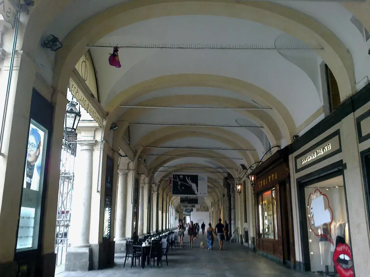 Turin's arcades make central café and coworking routes easier in hot or wet weather. Photo: rene boulay